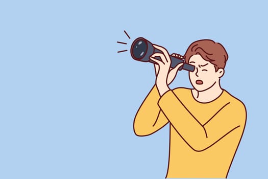 Shocked guy is looking through spyglass while looking at sights or watching rare astronomical phenomenon. Surprised man spying on neighbors using spyglass for uncoordinated surveillance