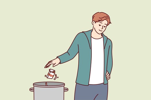 Man throws pack of cigarettes into trash can after quitting bad habit of smoking that causes cancer. Guy quits smoking and wants to start healthy lifestyle without dependence on nicotine or tobacco