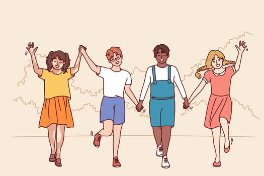 Friends teenagers diversity nationalities and races walk in park holding hands enjoying friendship and spending summer holidays together. Multiethnic boys and girls for concept diversity in society