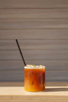 Iced coffee with orange in coffee shop, stock photo