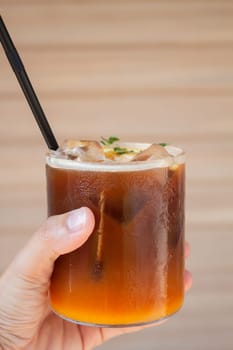 Iced coffee with orange in coffee shop, stock photo