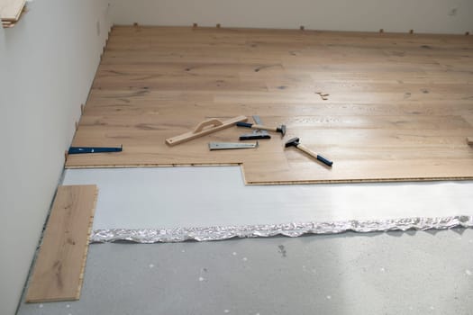 parquet floor laying in a new room, loft, new house