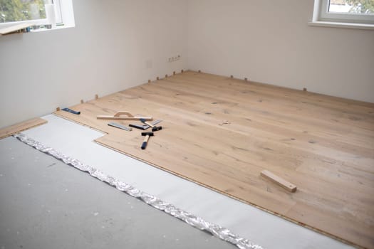 parquet floor laying in a new room, loft, new house