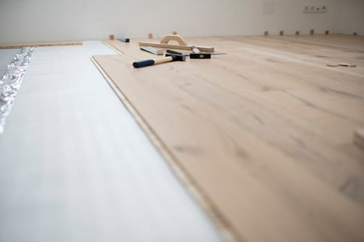 parquet floor laying in a new room, loft, new house
