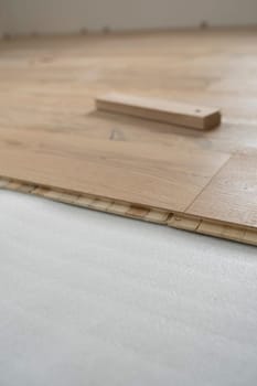 parquet floor laying in a new room, loft, new house