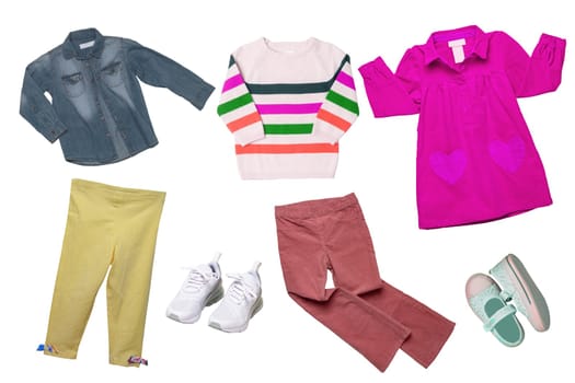 Collage set of girl spring summer clothes isolated. Female kids apparel collection. Child baby fashion clothing outfit. Colorful stylish jeans jacket, sweater, pants, shoes wearing.
