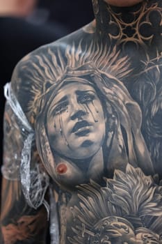Krakow, Poland -  June 11, 2022: Unidentified  participant at 15th Tattoofest Convention in Cracow. One of the most prestigious tattoo festivals.