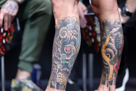 Krakow, Poland - June 11, 2022: Unidentified participant during the contest for the best tattoo at the 15th Tattoofest Convention in Cracow. One of the most prestigious tattoo festivals.