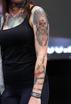 Krakow, Poland - June 12, 2022: Unidentified participant during the contest for the best tattoo at the 15th Tattoofest Convention in Cracow. One of the most prestigious tattoo festivals.