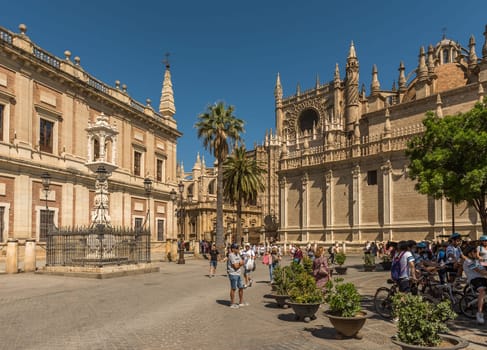 unidentified tourists in Plaza del Triunfo, Andalusia, Seville