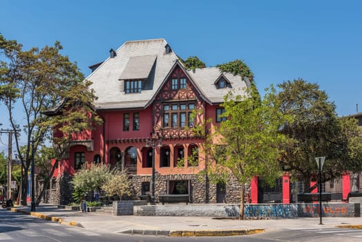 View of old red building at Plaza Camilo Mori in Bellavista, Santiago, Chile