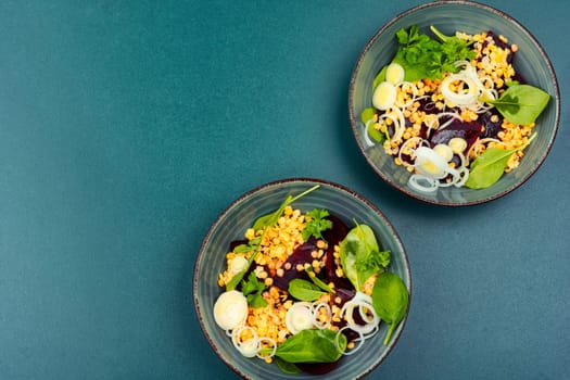 Salad with beetroot, lentils, onions and herbs in bowl. Traditional Indian cuisine.