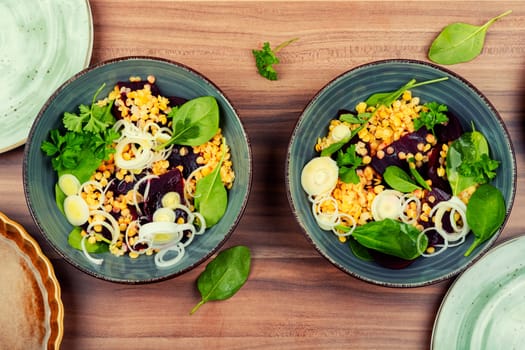 Salad with beetroot, lentils, onions and herbs in bowl. Traditional Indian cuisine.