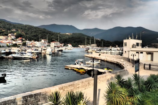 Meljine, Herceg Novi, Montenegro, August 13 2022 Boats, yachts and ships are at anchor. Moored ships in the parking lot. Adriatic Sea Mediterranean. Travel business. Sea travel and sports. Summertime