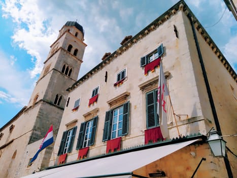 Stradun, Stradone is the main street of the historic city center of Dubrovnik in Croatia. architectural sights. A popular place for tourist walks. August 14, 2022 Tower and facades of ancient houses