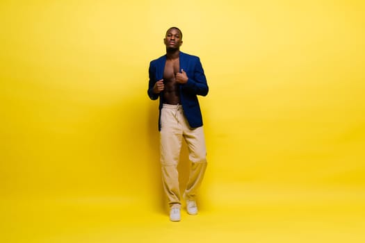 African American millennial businessman isolated on a studio background, successful male formal suit