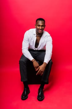 African American millennial businessman isolated on a studio background, successful male formal suit