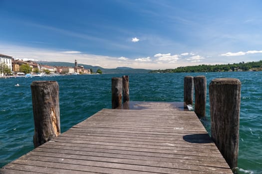 Riva del Garda view at the lake Garda, Italy. wooden pier