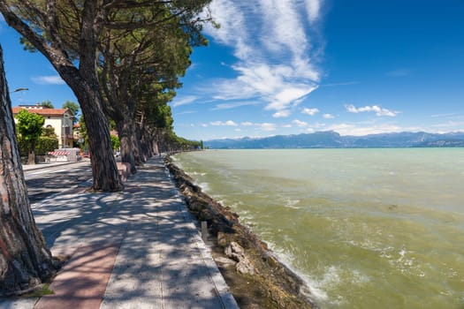 Pedestrian alley on the banks of Garda lake, Italy