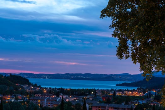 Blue sunset over the lake Garda, Italy