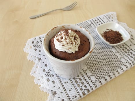Nougat Mug Cake with sugar cream and chocolate sprinkles