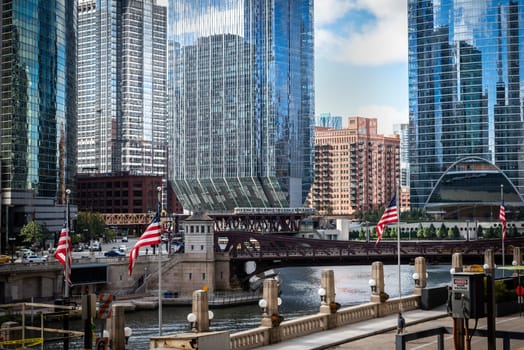 Chicago, Illinois, United States of America : October 11, 2018, Train on elevated tracks within buildings at the Loop, Glass and Steel bridge between buildings - Chicago City Center - Chicago, Illinois, USA