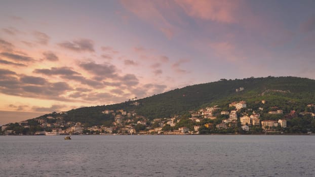 View of the mountains of Kinaliada island from Marmara Sea, with traditional summer houses and boats, Istanbul, Turkey