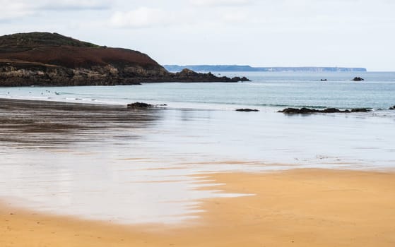 Pastel feeling of the coast and beach of Erquy in emerald coast, Brittany, France