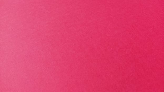 Beautiful pink or fuchsia bright background. Scarlet, purple, uneven color. A sheet of colored paper with a soft fleecy texture.