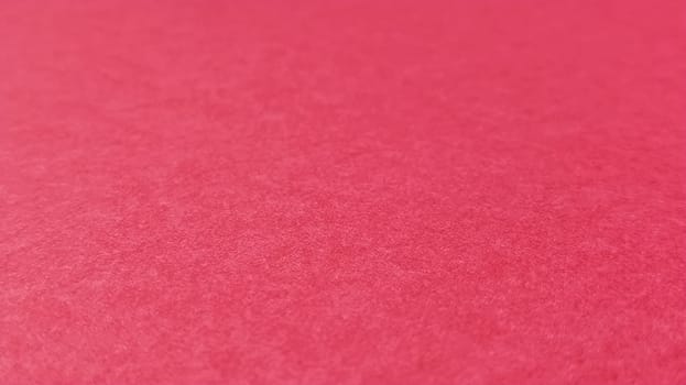 Beautiful pink or fuchsia bright background. Scarlet, purple, uneven color. A sheet of colored paper with a soft fleecy texture.