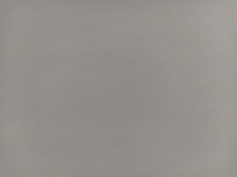 Grey background. Abstract smooth gray sheet of paper. Cellulose texture.