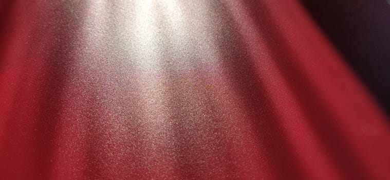 blurred striped red background. Play of light and shadow. Light rays. Divine or heavenly radiance from above. Simulate lighting something from above with spotlights. Copy space
