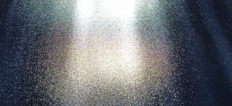 blurred striped dark black and blue background. Play of light and shadow. Light rays. Divine or heavenly radiance from above. Simulate lighting something from above with spotlights. Copy space.