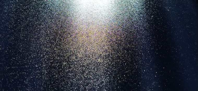 blurred striped dark black and blue background. Play of light and shadow. Light rays. Divine or heavenly radiance from above. Simulate lighting something from above with spotlights. Copy space.