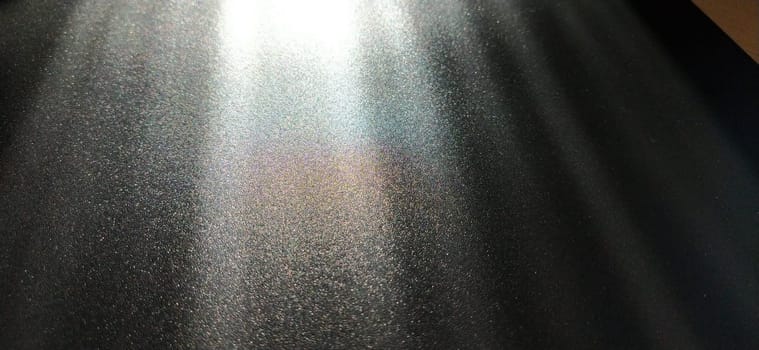 Light beam on black background with sparkles, radiance and sparkles. Festive background. Divine or moonlight effect. Rays falling from top to bottom. The spotlight is shining.