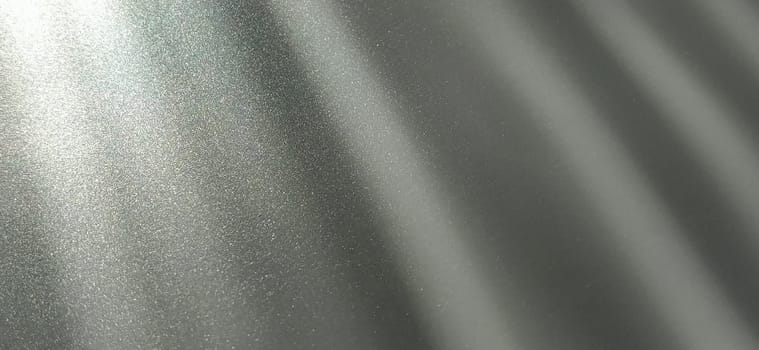 Gray striped background with oblique light effect. Play of light and shadow. Light rays. Gray and silver shades with white dots and shining stars. Diagonal lines from left to right.