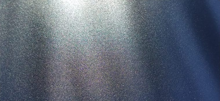 blurred striped dark black and blue background. Play of light and shadow. Light rays. Divine or heavenly radiance from above. Simulate lighting something from above with spotlights. Copy space.