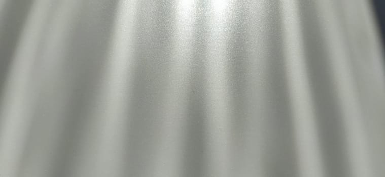 blurred striped gray background. Play of light and shadow. Light beams. Gray and silver shades with white dots and shining stars. Divine or heavenly glow from above.