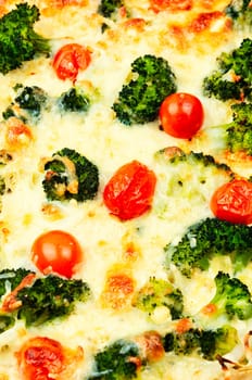 Diet potato casserole with broccoli and tomatoes. Vegetarian food. Food background
