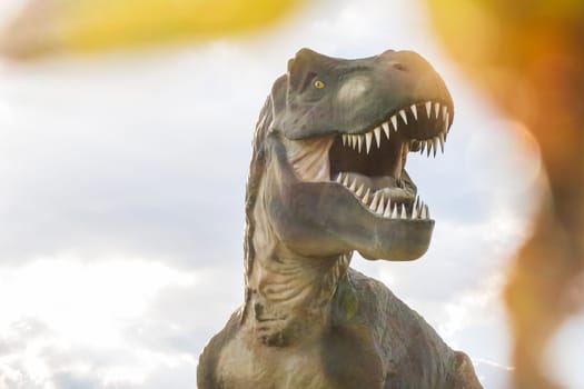 Tyrannosaurus Rex or T-Rex cretaceous dinosaur, photography  with a blurry foreground