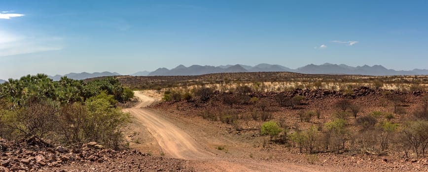 The dusty gravel road along the Kunene River in northern Namibia
