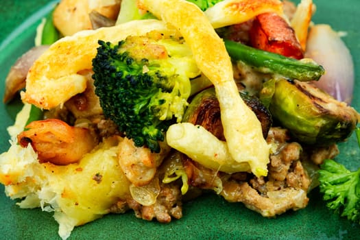 Savoury meat pie with brussels sprouts, pumpkin and broccoli. Autumn recipe.