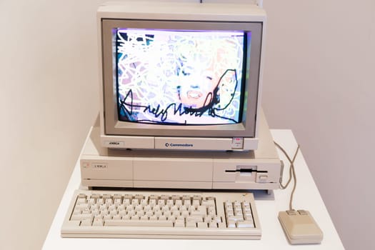 Venaria Reale, Italy - October 2022: Computer Commodore Amiga 1000 with floppy disk, mouse, beige