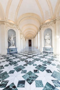 Venaria Reale, Italy - January 2023: luxury interior old royal palace. Gallery perspective with window