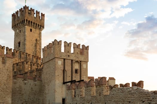 Sirmione, Italy - June 2022: Sirmione castle on Garda lake. Scenic mediaeval building on the water