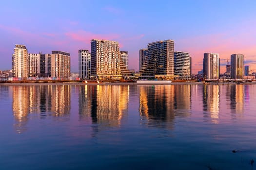 District with modern acrhitecture Belgrade Waterfront, known in Serbian as Belgrade on Water, on river Sava during golden hour, Belgrade, Serbia