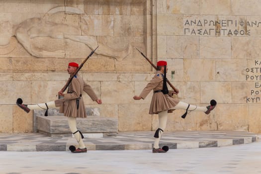 ATHENS, GREECE - MAY 06 2022: Presidential ceremonial guards - Evzones at the Tomb of the Unknown Soldier in front of the Greek Parliament, Athens, Greece