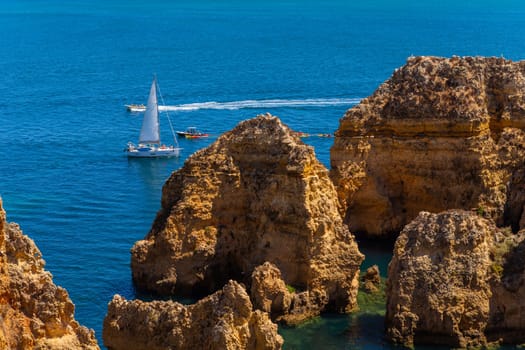 Lagos, Portugal - 25 August 2025: Tourists visiting Ponta da Piedade, in Lagos. Algarve, Portugal