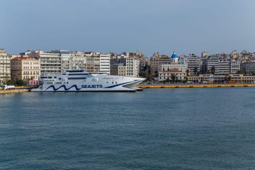 Pireas Greece: May 07 2022: Ferry boat cruise ships docking at the port of Piraeus Greece. The port of Piraeus is the largest passenger port in Europe and the third largest in the world.