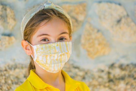 Little girl with mask against corona virus covid outdoor